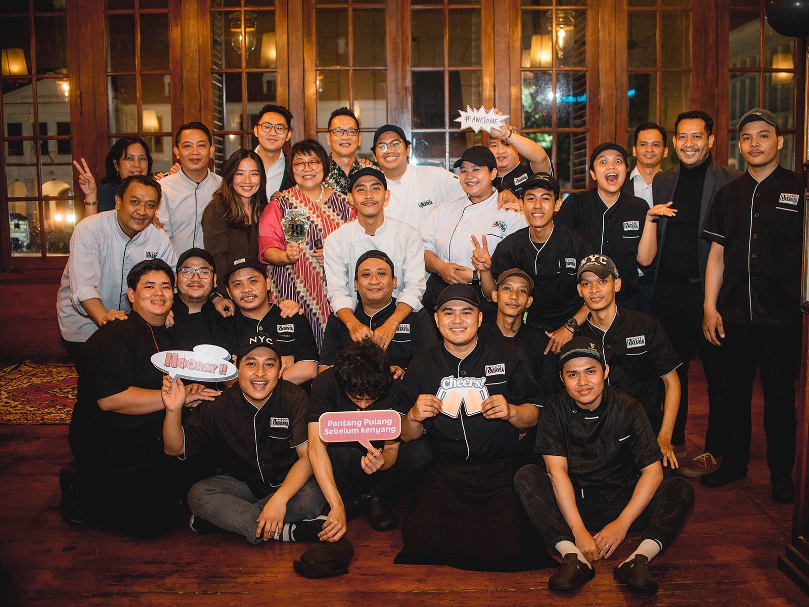 Cafe Batavia team celebrating the 30th anniversary